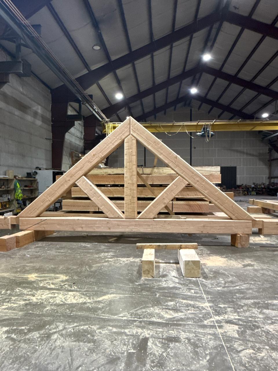 Timber truss standing in the mill